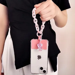 Pink and white resin chain phone lanyard with heart bear charm on clear phone case