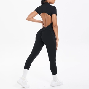 Detail of black open back jumpsuit with scrunch butt lifting seam and short sleeves