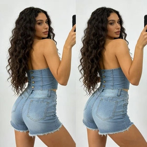 Detail view of denim two-piece set featuring frayed hem shorts and slim fit tube top