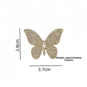 Detailed view of crystal butterfly brooch showing dimensions 3.7cm by 2.8cm and 8g weight