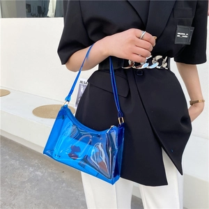 Minimalist transparent blue PVC shoulder bag styled with a modern black blazer for women
