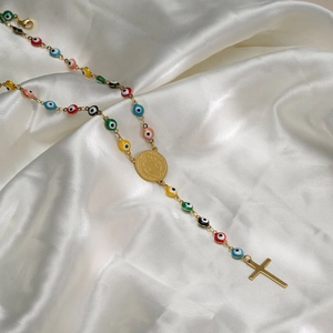 Turkish Evil Eye rosary necklace with colorful beads and gold cross on white silk