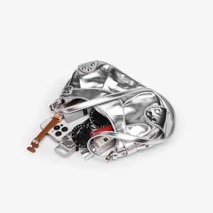 Top view of silver crocodile pattern handbag showing interior space with daily essentials