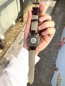 Macro detail of stainless steel watch back and genuine leather strap for men