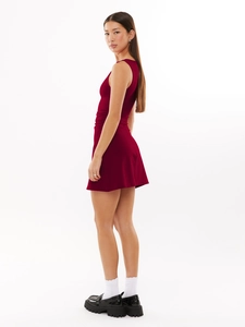 Side view of a slim-fit burgundy Y2K sleeveless dress with ruched waist and bodycon cut