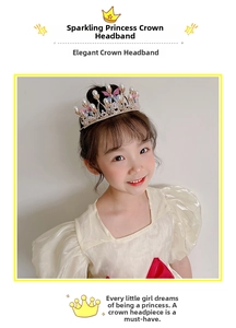 Close-up of golden crown headband with white pearls, rhinestones and butterfly detail