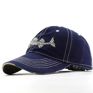 Detail of navy blue baseball cap featuring fishbone embroidery and camouflage underbrim
