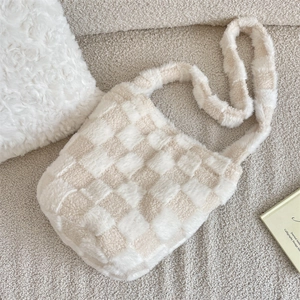 Detailed macro of plush checkerboard bucket bag texture on a cozy beige background