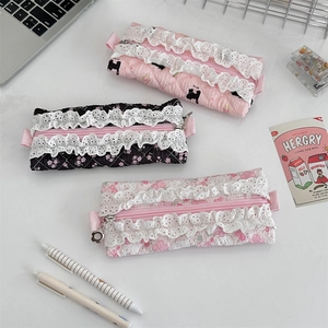 Quilted lace pencil case with floral patterns and cute zipper pulls in lifestyle setting