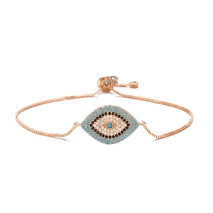 Macro shot of rose gold Evil Eye bracelet with blue and white zircon stones and adjustable chain
