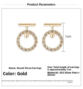 Close-up of gold circle zirconia earrings with 925 silver needles and paved crystals
