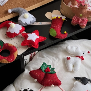 Macro detail of handmade Christmas felt ornaments with sequins and reindeer for DIY decor