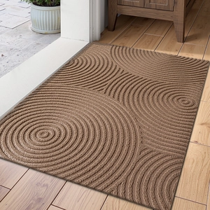 Detailed texture of brown rectangular entry mat with overlapping circular patterns