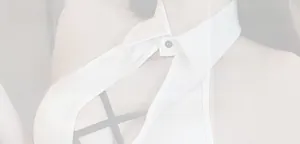 Detail of sexy maid uniform featuring black and white halter neck and cutout design