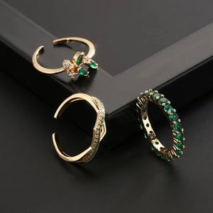 Three-piece 18K gold plated ring set with green zircon in geometric and floral designs