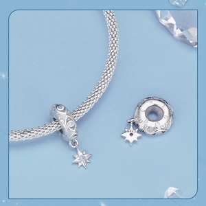 Macro shot of a S925 sterling silver star charm with opal inlay for DIY bracelets