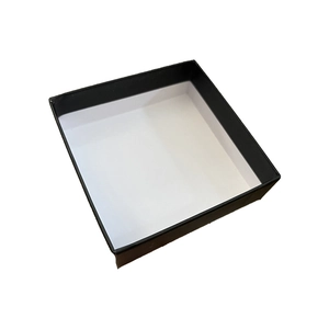 Top view of empty square jewelry gift box with elegant black exterior and white interior