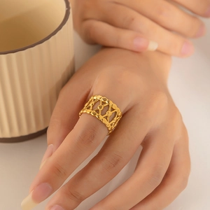 Minimalist 18K gold plated stainless steel irregular twisted geometric ring on model hand