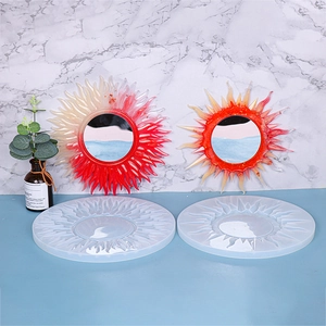 Macro detail of sunflower silicone molds with resin sunburst mirrors in red and orange