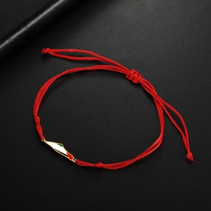 Detail of red braided Palestine map bracelet with gold metal and tricolor enamel charm
