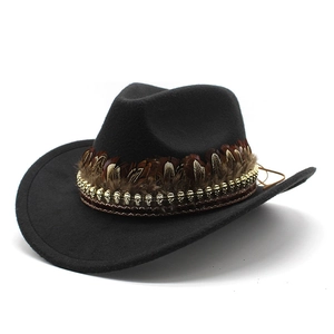 Western cowboy wool hat in black with decorative brown feathers and metal skulls