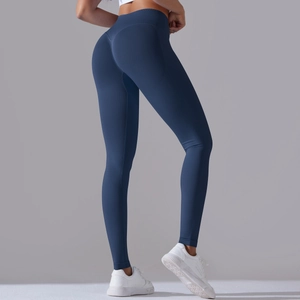 Rear view of navy blue high waist yoga pants showing peach lift and seamless design