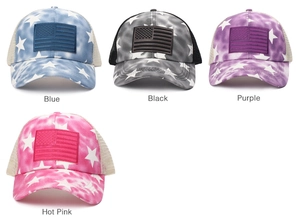 Detailed view of four colorful US flag trucker hats with stars and stripes patterns