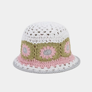Close-up of hand-crocheted hollow flower patterns on a vintage-style cotton bucket hat