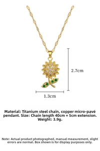 Detail view of sunflower pendant with white zircons and green gems on gold chain