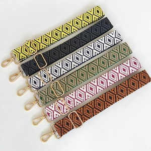 Thick colorful woven shoulder straps with ethnic geometric patterns and gold metal buckles