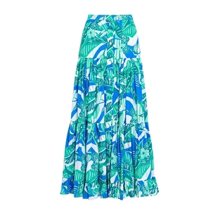 Close-up of high-waisted tiered maxi skirt with tropical plant print and front buttons