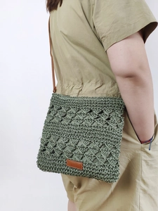 Moss green handmade woven paper rope crossbody beach bag with brown leather strap