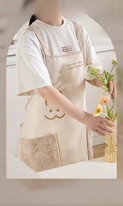 Detail of coral fleece hand-drying pocket and cute bear print on waterproof apron