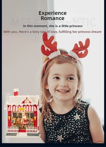 Close-up of Santa's Workshop music box with detailed miniature scene and a child model
