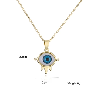 Detailed view of the 18K gold-plated evil eye pendant showing dimensions 2.6cm by 2cm