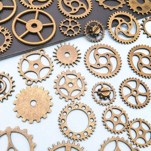 Macro detail of various vintage bronze steampunk gears for DIY jewelry making and crafts