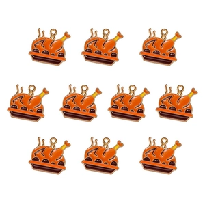 Macro shot of 10 orange enamel roasted turkey alloy pendants for DIY jewelry making