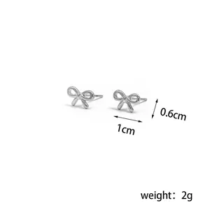 Detailed view of 1cm bow stud earrings in silver finish with weight specifications