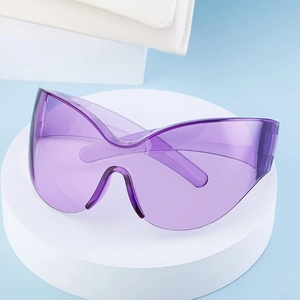 Detail of purple oversized wrap-around sports sunglasses with butterfly shield lens