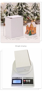 Detailed size and weight view of a light-up resin Christmas snow house with packaging