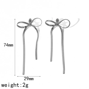 Detailed view of silver ribbon bow tassel earrings with grid texture and size dimensions