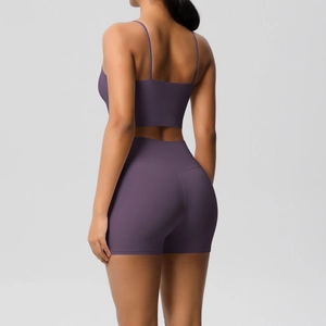 Rear view of purple yoga set showing thin straps and high waist shorts fit