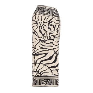 Detail of high-waist long skirt featuring artistic cream and black abstract floral prints