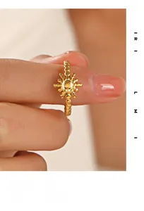 Detail of 18K gold plated sunburst ring featuring a beaded band on model's hand