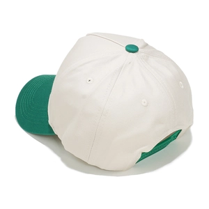 Detail view of the green snapback closure and white cotton twill panels on the baseball cap