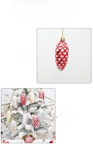 Detail of glittery Christmas pine cone ornaments with snow effect on a festive tree branch
