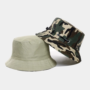 Detail of camouflage and solid outdoor sun hats with metal eyelets and adjustable chin strap
