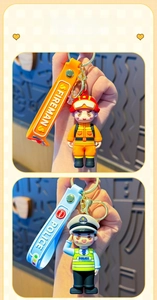 Detail of firefighter and police officer keychains with matching branded wrist straps