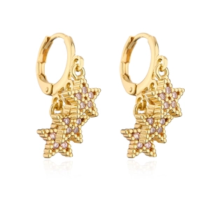 Detail of 18K gold-plated hoop earrings with pink zircon-studded star charms on white