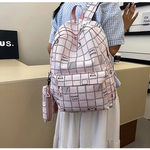 Pink checkered backpack detail with mini matching pouch and minimalist bunny pattern